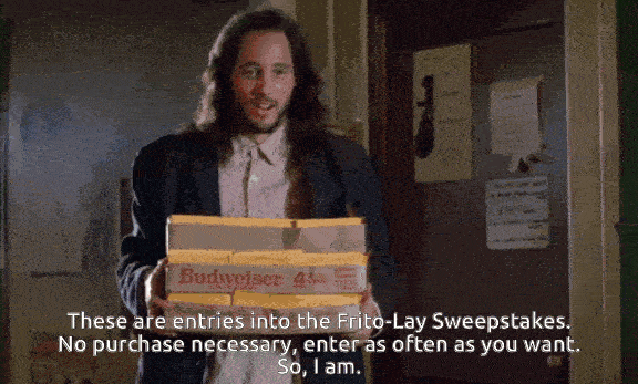 GIF of Lazlo from Real Genius holding two Budweiser boxes filled with hundreds of ballots, saying “These are entries into the Frito-Lay Sweepstakes. No purchase necessary, enter as often as you want. So, I am.”