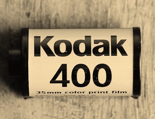 a close up of a battery on a wooden surface