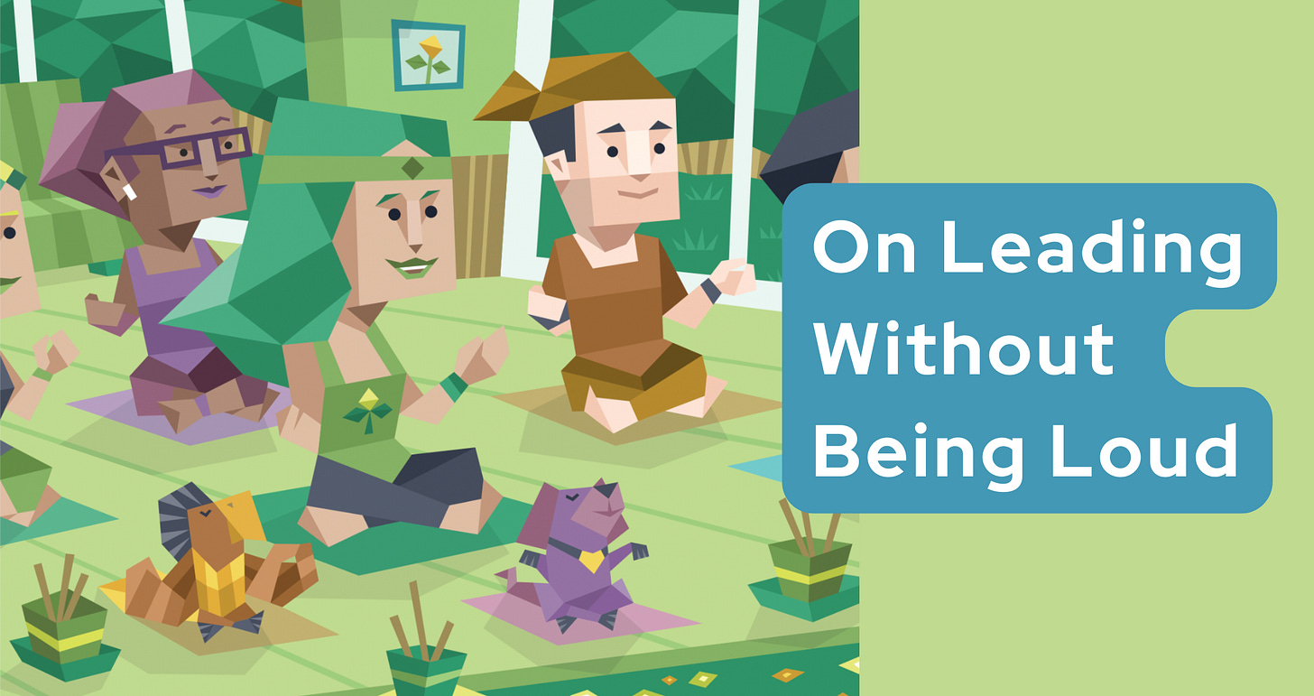 An INFJ woman leads a small group of people (and animals) through yoga. Text in a blue banner readers: On leading without being loud.