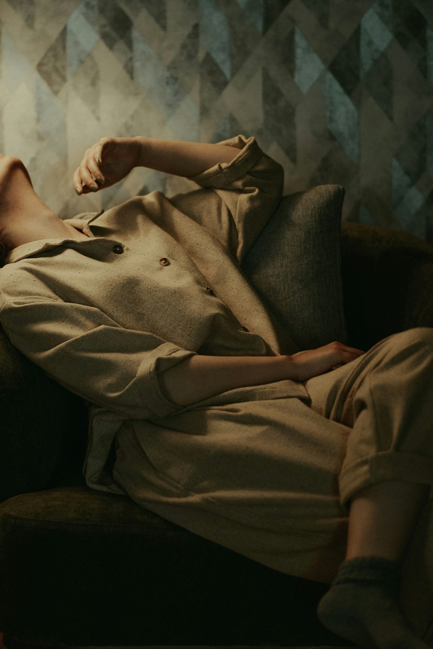 woman with head back, on an armchair