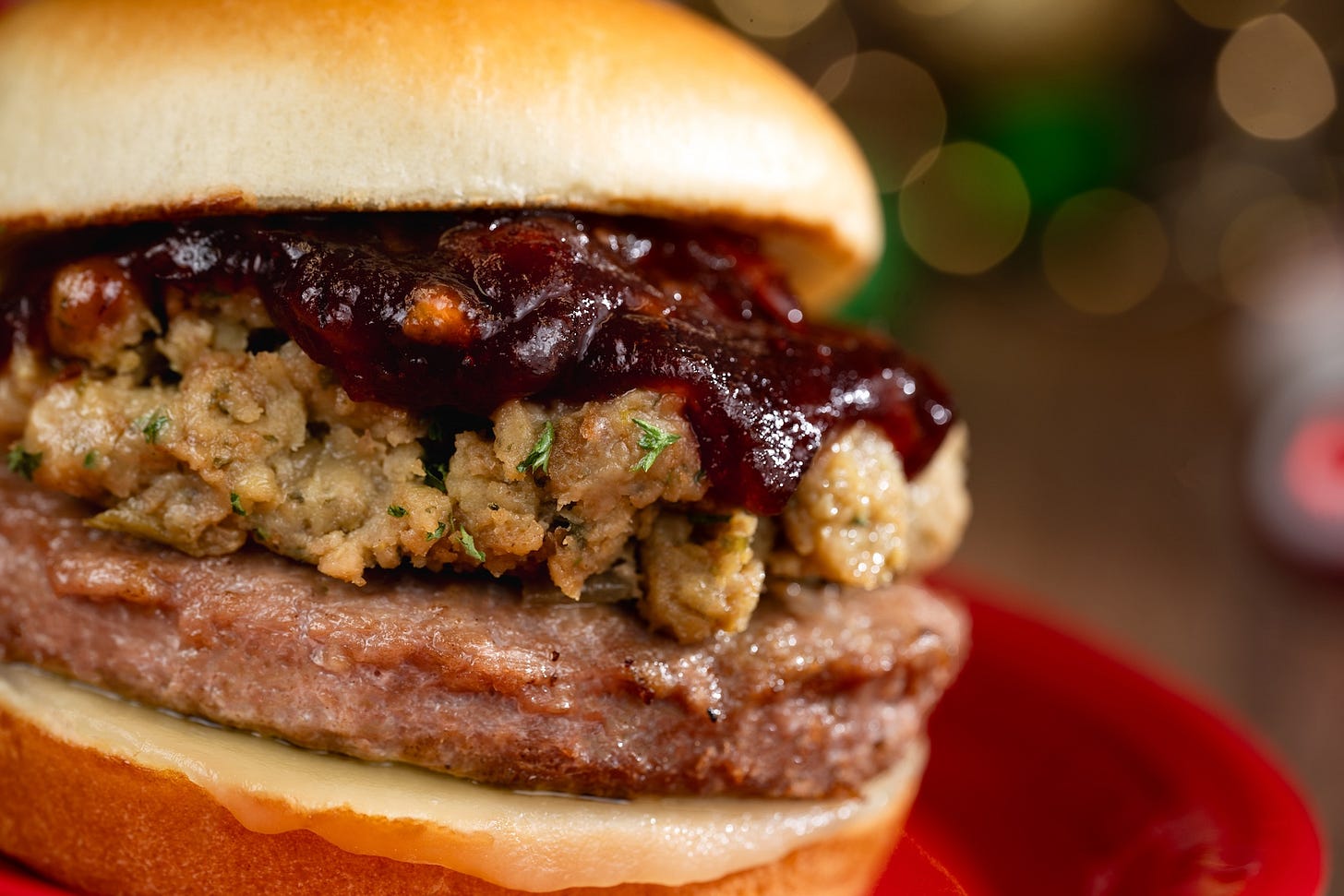 Holiday Turkey Burger topped with traditional stuffing, Swiss cheese, and cranberry chutney on a brioche bun