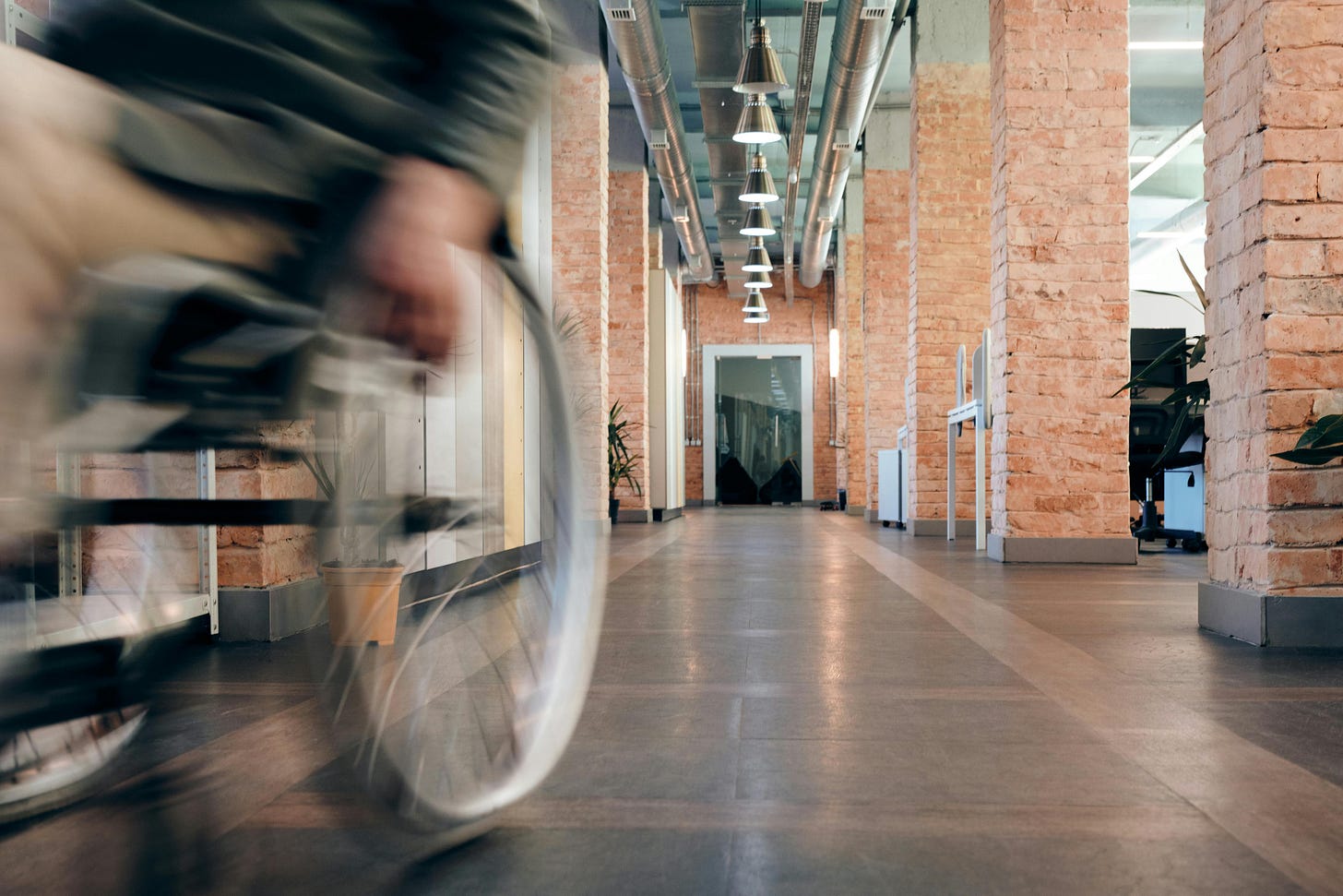 Wheelchair racing through a hallway