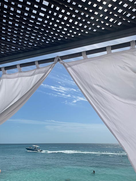 White cabana with a beach view
