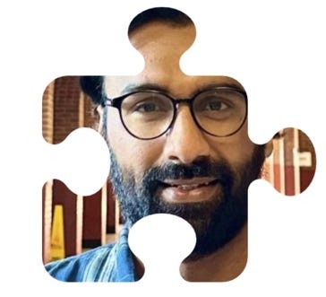 A person wearing glasses and a beard

AI-generated content may be incorrect.