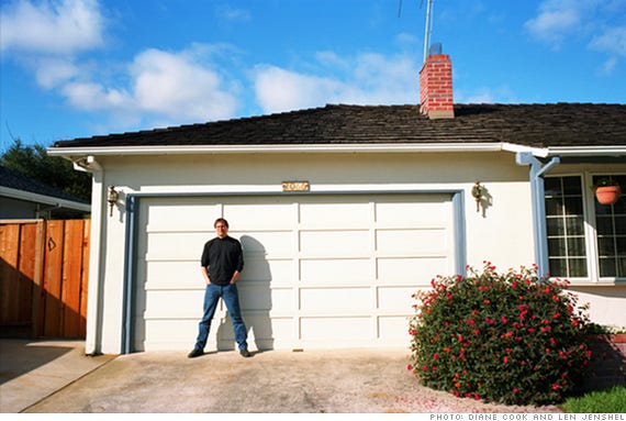 Steve Jobs in front of the garage where Apple was born at 2066 Crist Drive, Los Altos, California in 2006