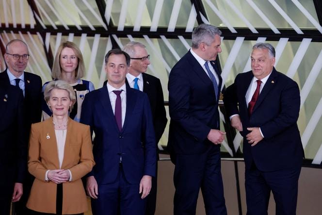 Hungarian Prime Minister Viktor Orban (right) shortly before the family photo at the summit of European Union and Balkan leaders in Brussels on December 13, 2023.