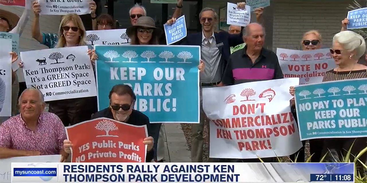 Residents rallied in front of Sarasota City Hall with signs to keep park public and free and green Residents rallied in front of Sarasota City Hall with signs to keep park public and free and green