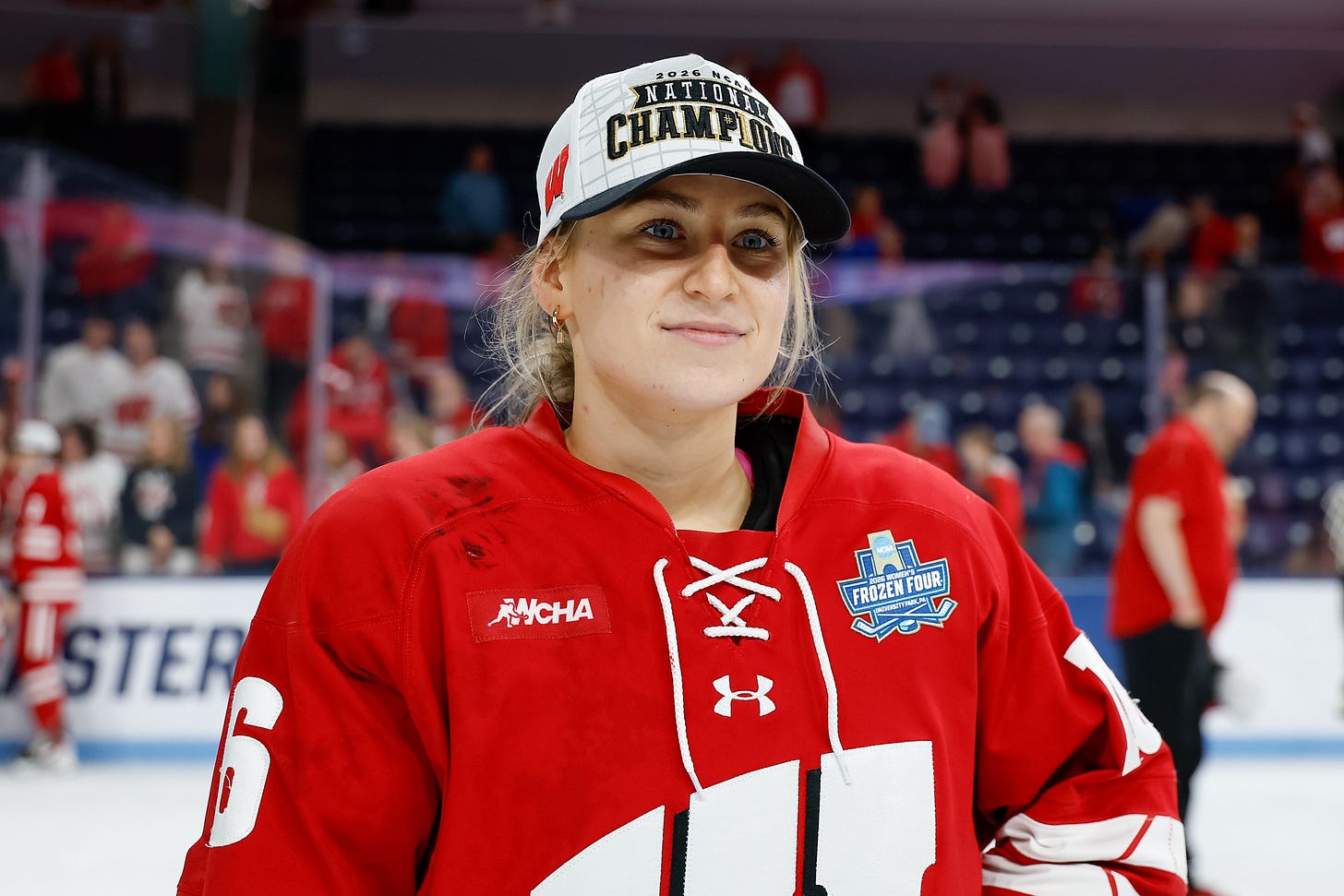 Claire Enright on the ice after the 2026 frozen four championship game during an on-ice celebration