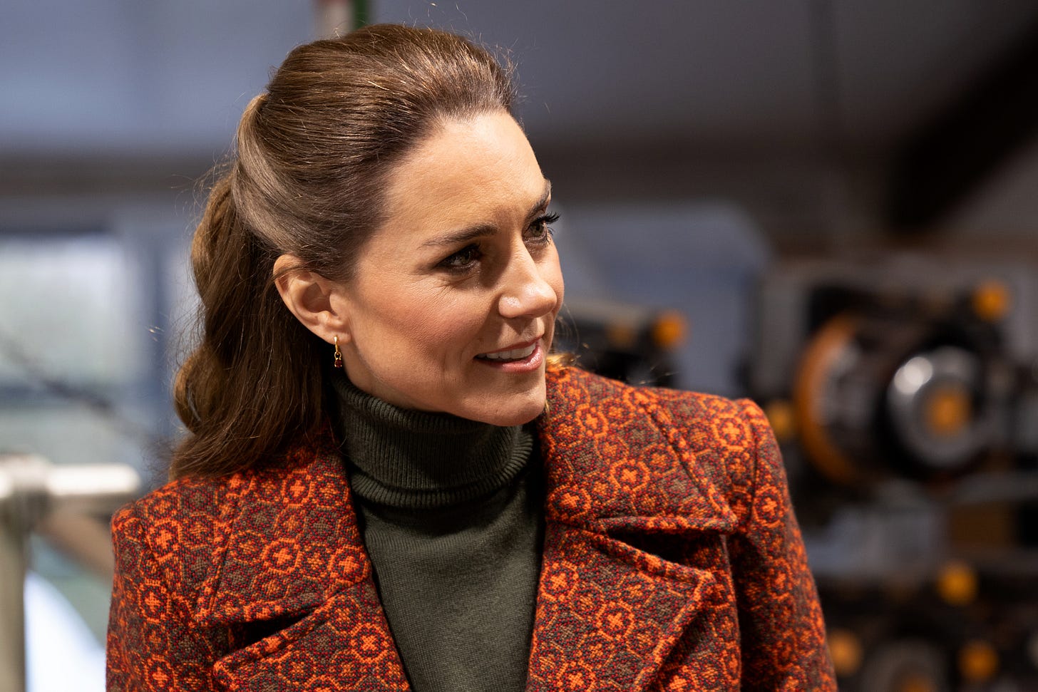 Princess Kate in roll neck and patterned orange coat