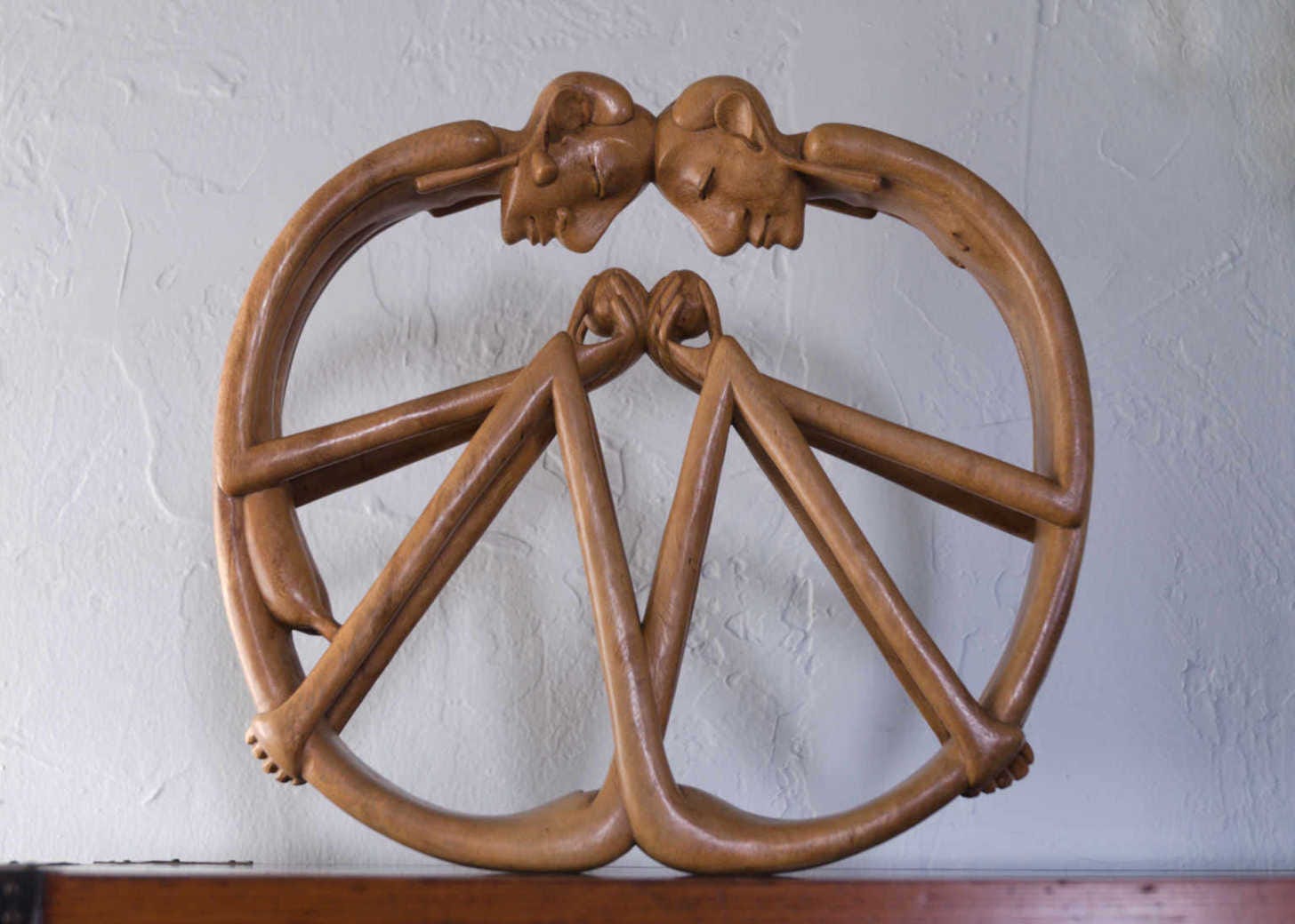 Wood carving of couple
