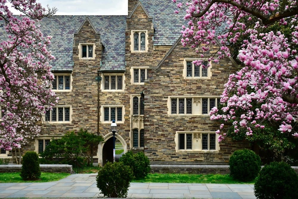 A photo of a gothic building on the Princeton campus in springtime on an overcast day.