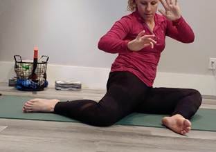 A person sitting on a yoga mat

AI-generated content may be incorrect.