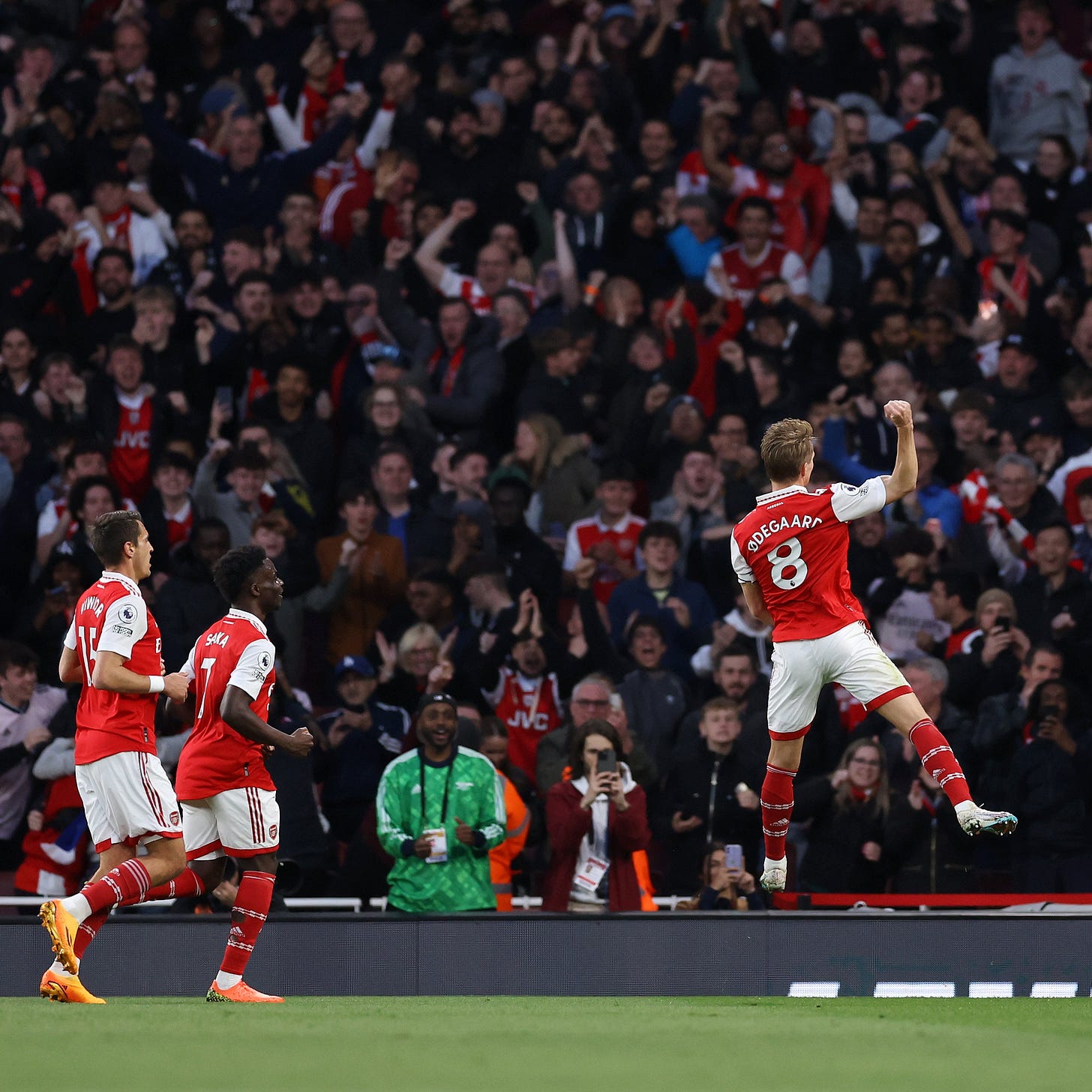 Martin Odegaard celebrates his goal in front of the Clock End.