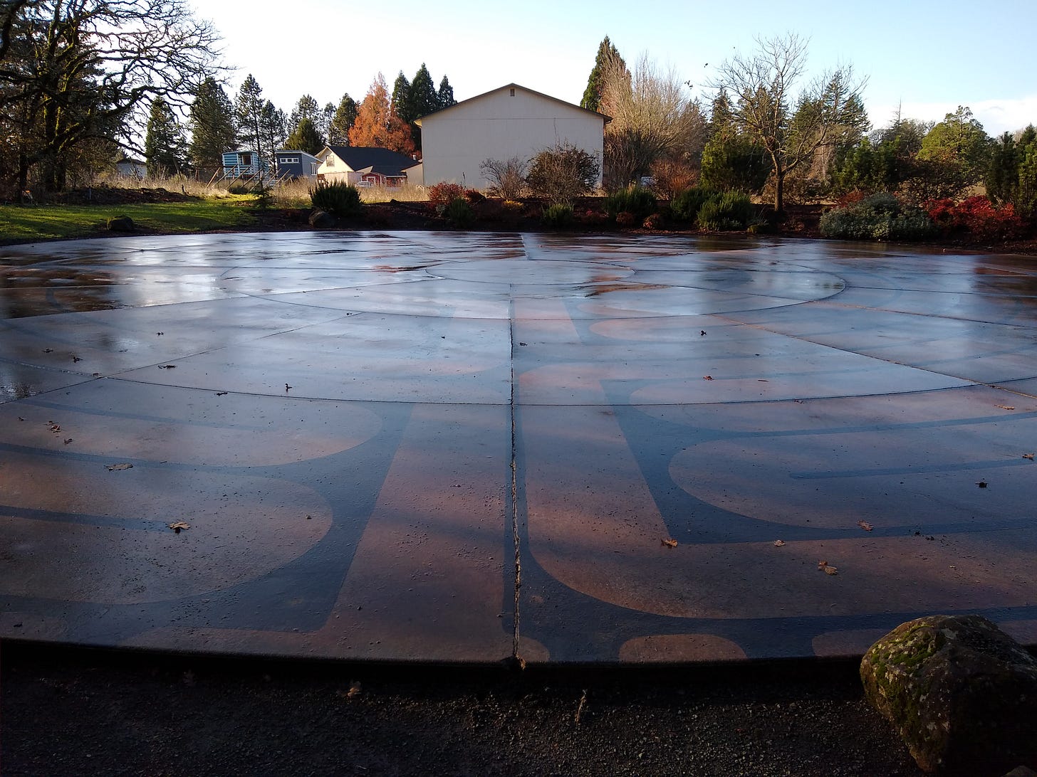 Prayer labyrinth, shining wet in the sun