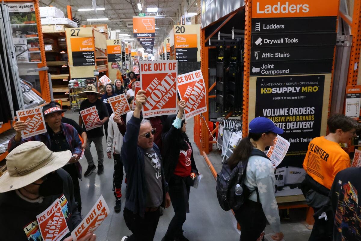 Protestors march inside Home Depot during a protest event hosted by The National Day Labor Organizing Network. Protestors march inside Home Depot during a protest event hosted by The National Day Labor Organizing Network.