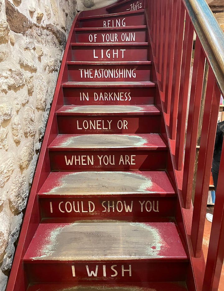 Cozy reading room and stairs with inspirational quote