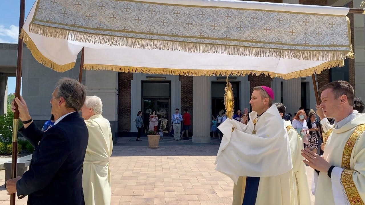 Bishop Hicks leads a Eucharistic procession to begin the National  Eucharistic Revival.