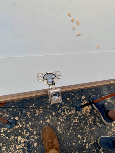 Adding Euro hidden hinges to cabinet doors.