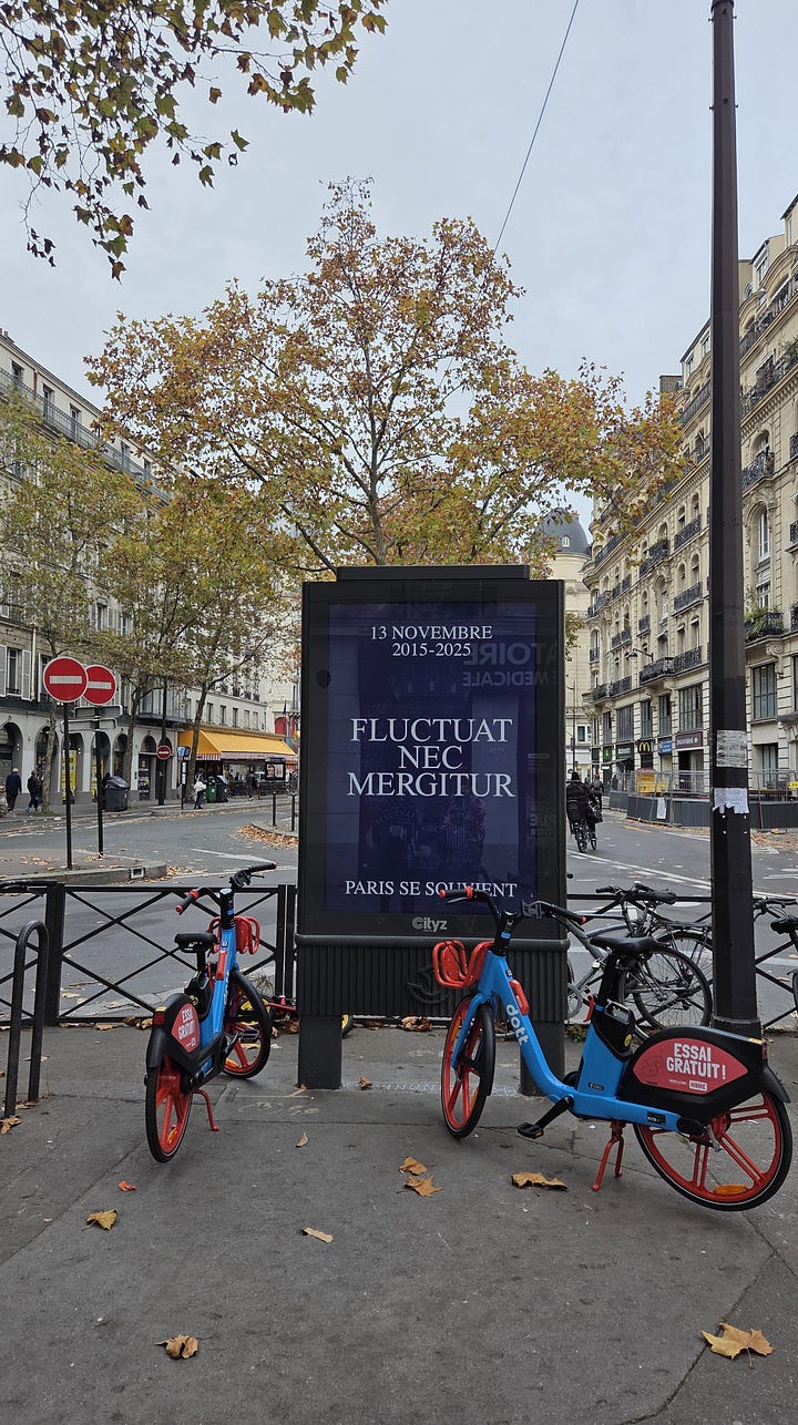 photos of Paris - billboard saying fluctuat nec mergitur and a panorama with the seine