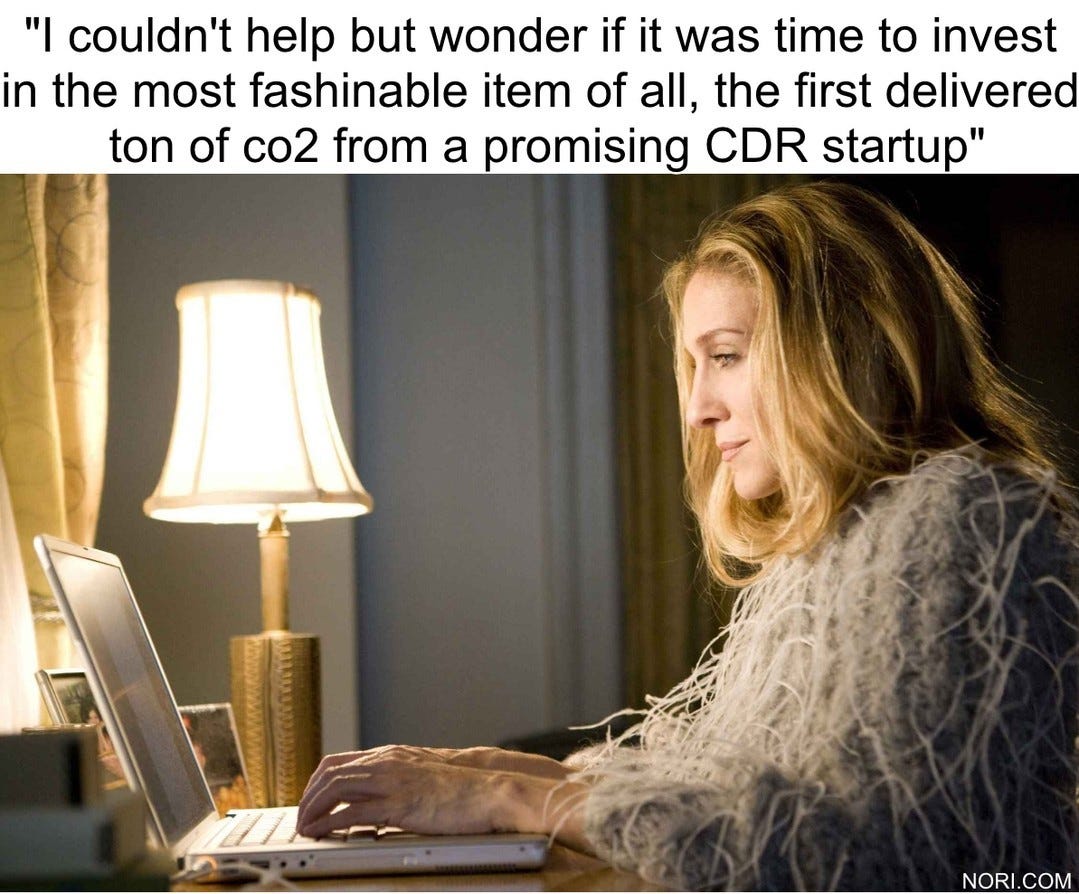 Carrie Bradshaw typing at a laptop by lamplight, under the quote "I couldn't help but wonder if it was time to invest in the most fashionable item of all, the first delivered tonne of co2 from a promising CDR startup".