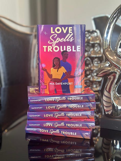 Gallery of pictures of "Love Spells Trouble," Nia, readers, and the books characters