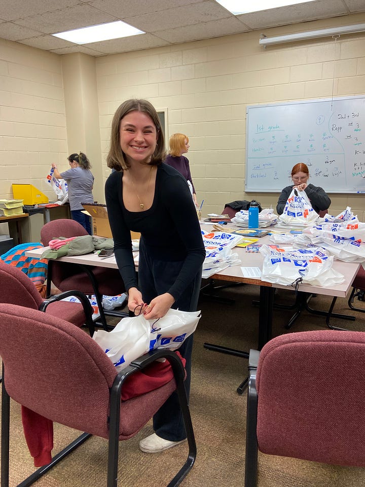 University students pack book bags to donate to elementary school children