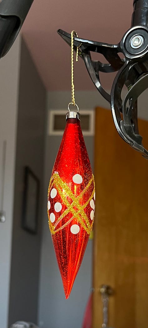 I kicked off the holiday season by doing one of my new favorite things: refreshing glitter on vintage ornaments. These beauties were covered in blackened glitter so I scraped that off using a small straight pin, dusted them and then used a small paintbrush to place glue where the old glitter had been. Then I dusted them with fresh glitter and VOILA! They are gorgeous once more. I've done this many times while watching TV and it's SO rewarding. 