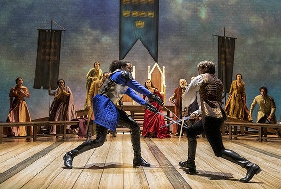Jordan Donica, Phillipa Soo (background center), Andrew Burnap, and the company of Lerner & Loewe's CAMELOT.