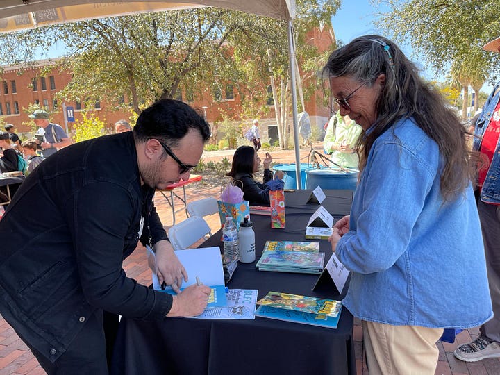 Henry Barajas at the Tucson Festival of Books "Tucsones Voces" panel at the Nuertras Raices stage on the U of A Mall.