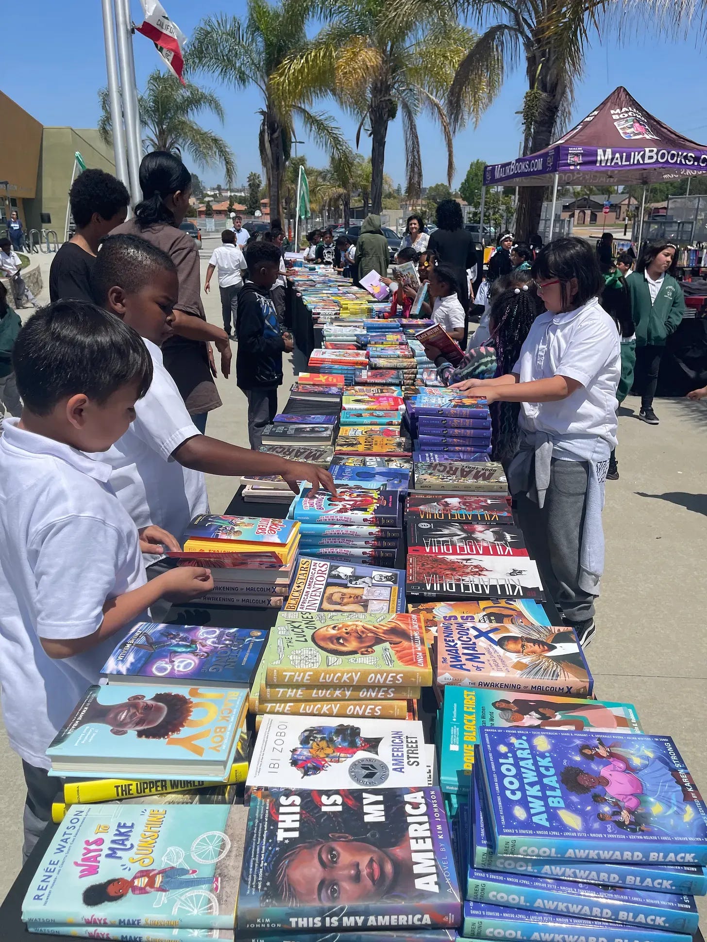 Families gathered at the Black Children's Book Festival hosted by Malik Books Families gathered at the Black Children's Book Festival hosted by Malik Books