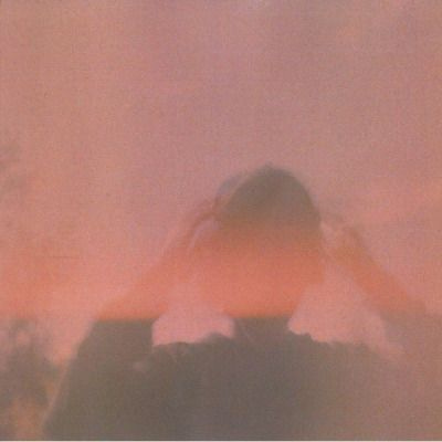 This may contain: a blurry image of a person covering their face