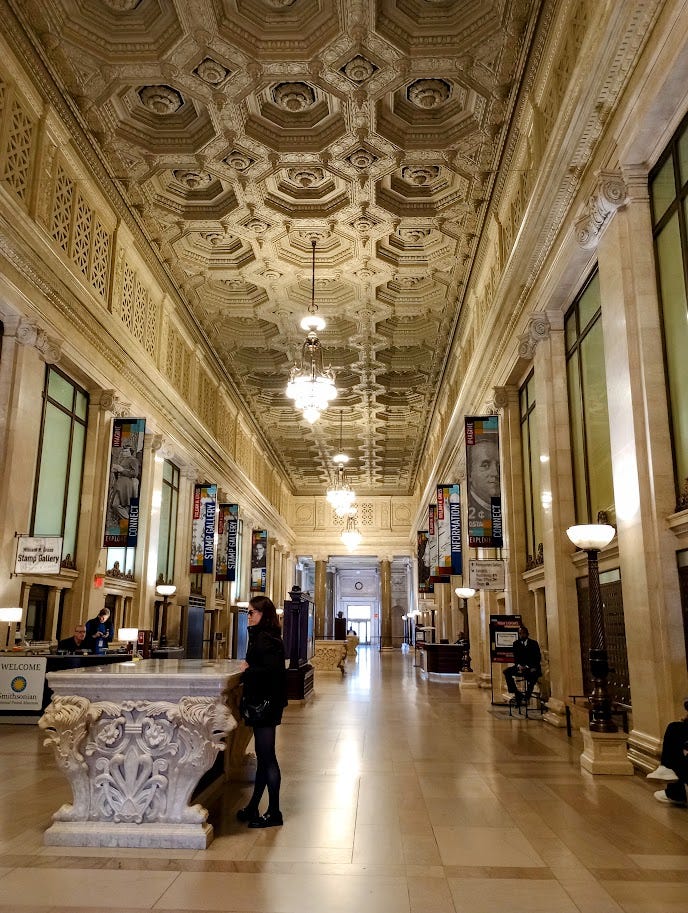 Grand hallway with elaborate ceiling, chandeliers, and columns Grand hallway with elaborate ceiling, chandeliers, and columns