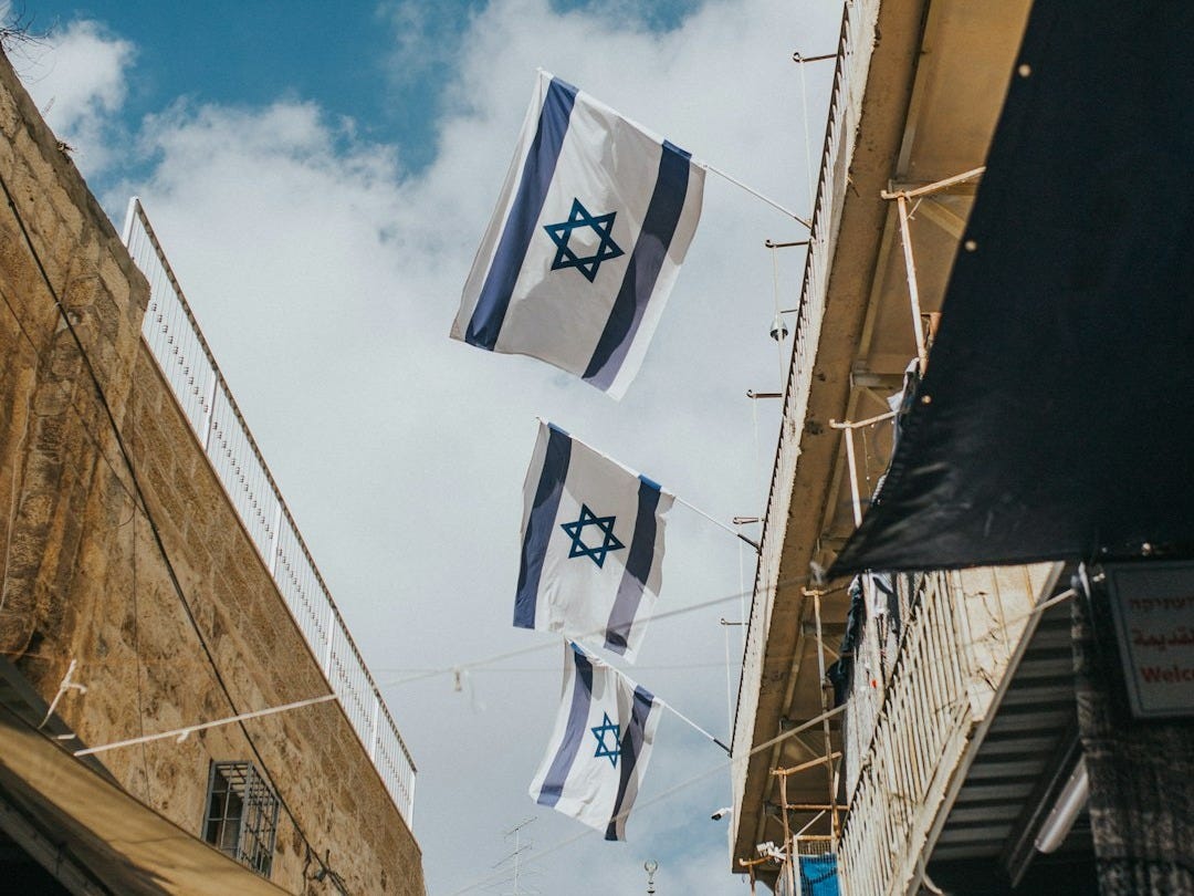 flags hanging on roof during daytime
