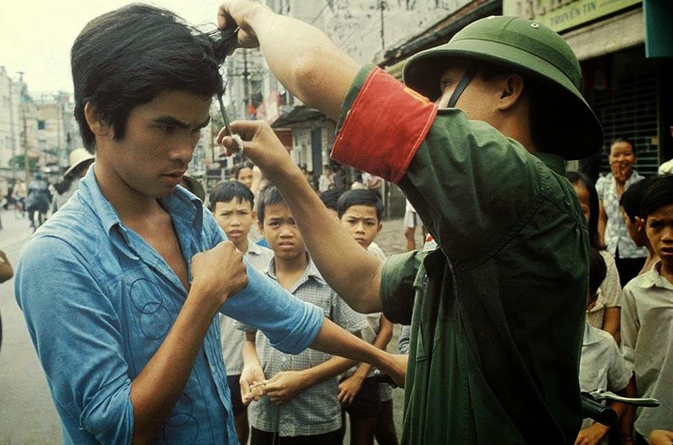The Fall of Saigon, Vietnam in April, 1975. The Vietcong cutting hair and "western" clothes. The Fall of Saigon, Vietnam in April, 1975. The Vietcong cutting hair and "western" clothes.