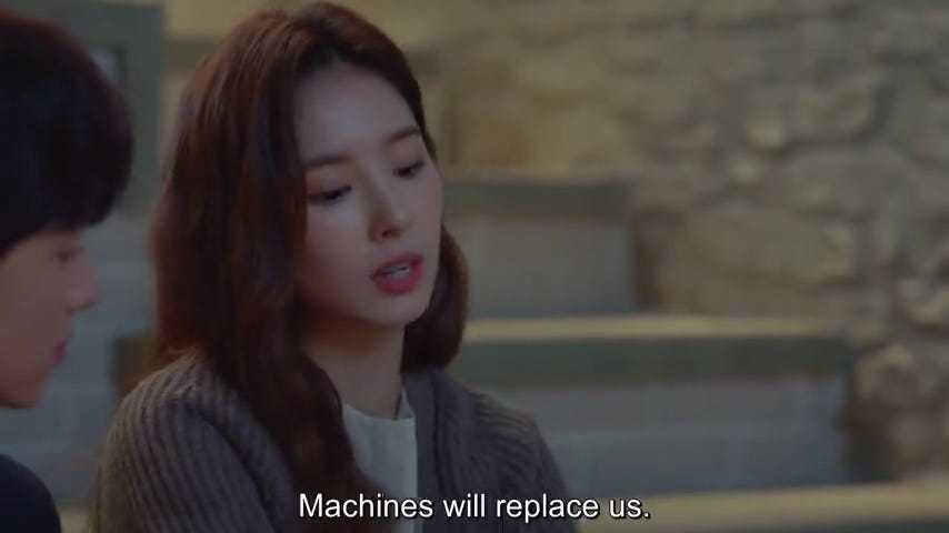 a woman observes sadly, "machines will replace us."