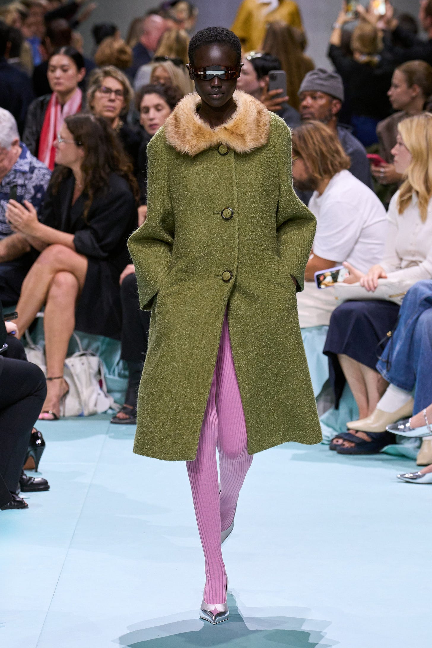 Image may contain Clothing Coat Person Footwear High Heel Shoe Adult Electronics Mobile Phone Phone and Hat Image may contain Clothing Coat Person Footwear High Heel Shoe Adult Electronics Mobile Phone Phone and Hat