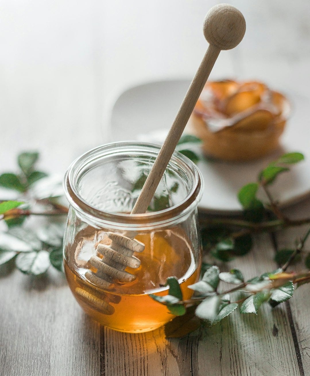 clear glass jar with orange liquid