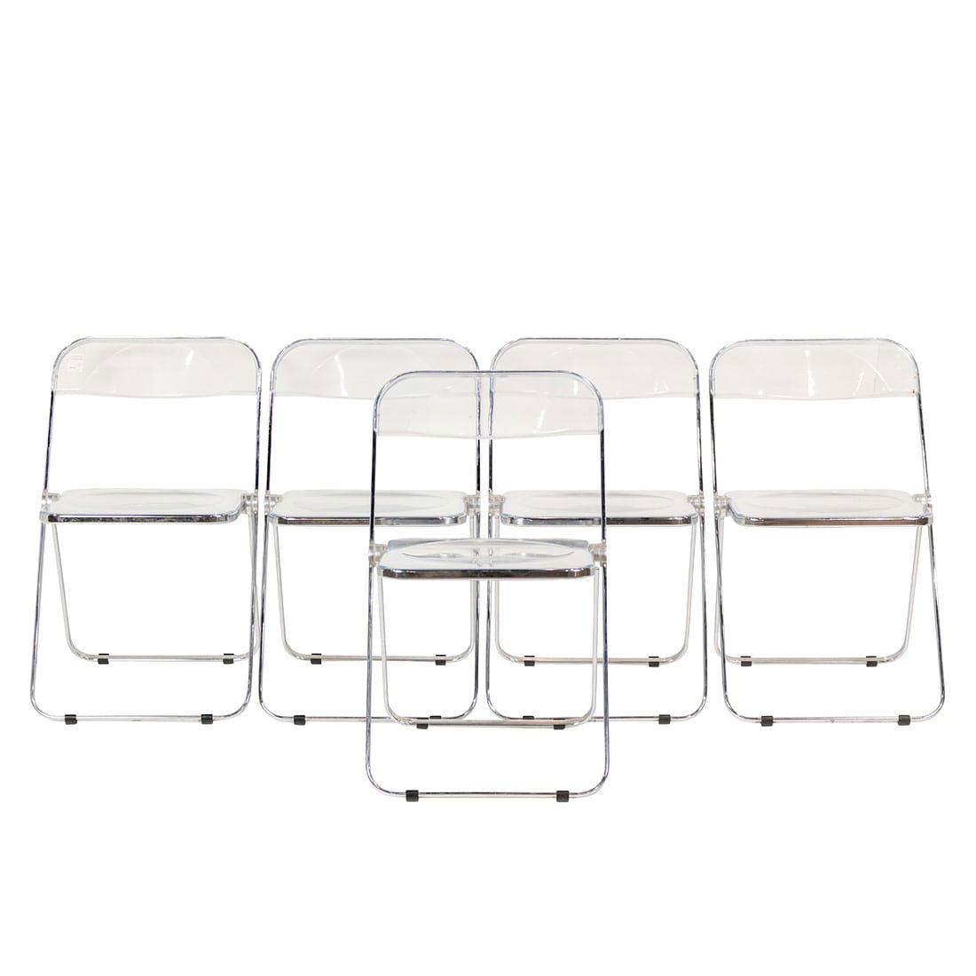A set of five 'Plia' clear molded plastic and chrome plated steel folding chairs by Giancarlo