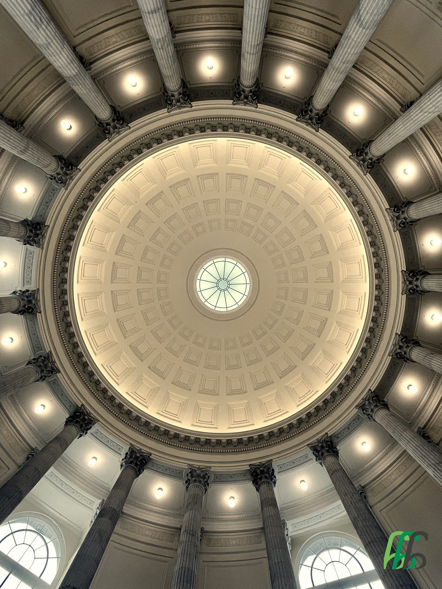 Photo looking up at the center of the Cannon house office building rotunda ceiling with columns and peak through window. For more about the rotunda, read here: https://www.aoc.gov/about-us/news-notices/cannon-buildings-refreshed-rotunda