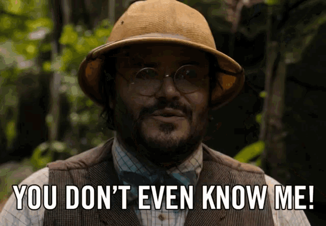 a man wearing glasses and a hat says you don 't even know me a man wearing glasses and a hat says you don 't even know me