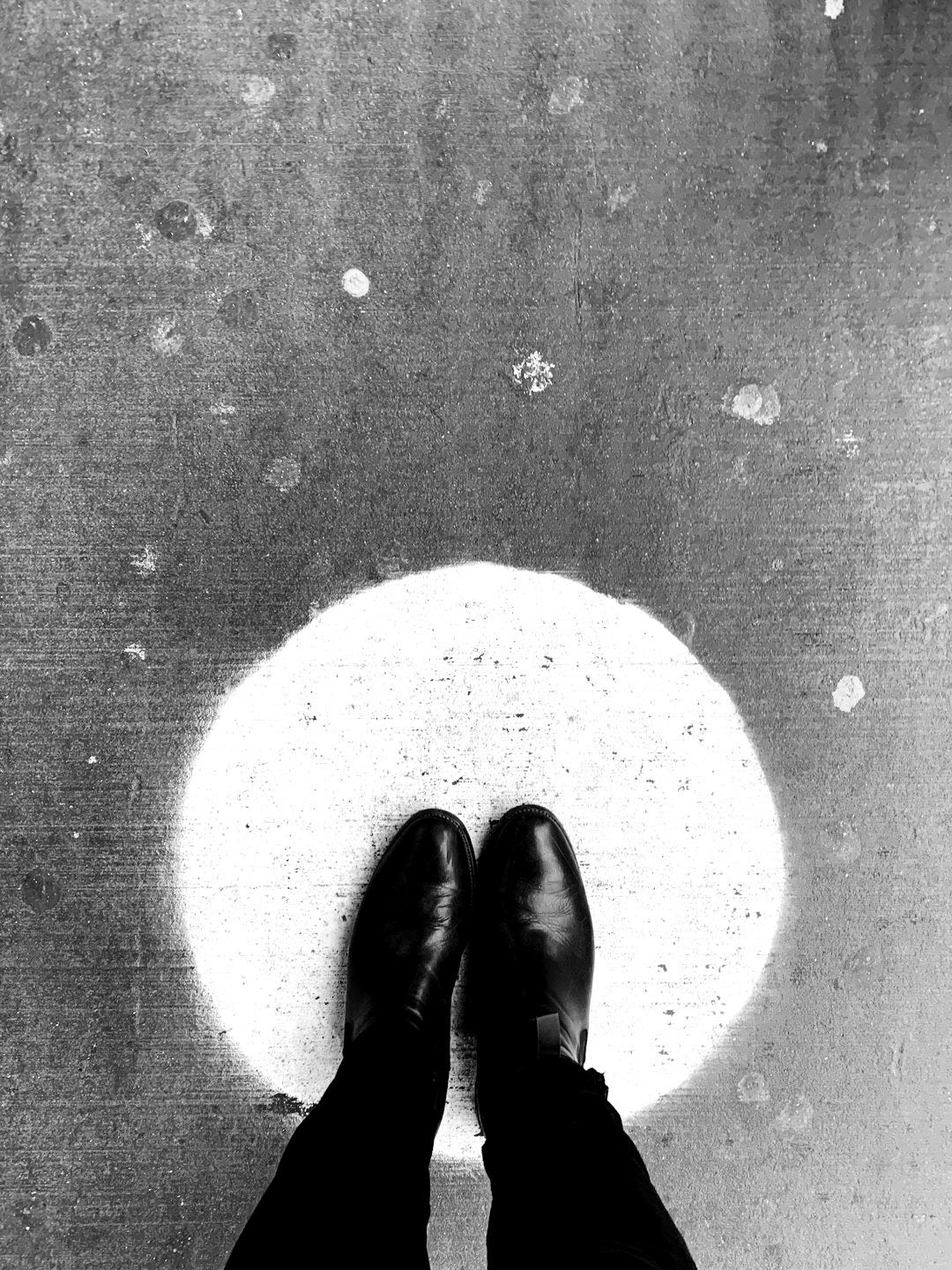 person standing on round yellow painted surface person standing on round yellow painted surface