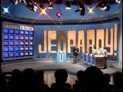This may contain: two men on stage with microphones in front of them and the words jerry written on it