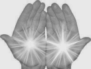 This may contain: two hands with white light shining through them