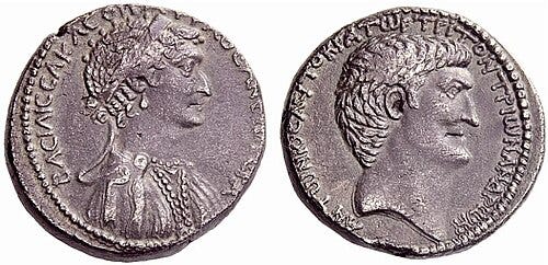 A silver coin depicting the heads of Cleopatra and Mark Antony