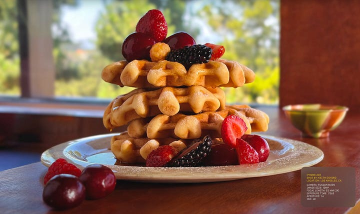 a close-up image of a woman with an afro, a stack of waffles