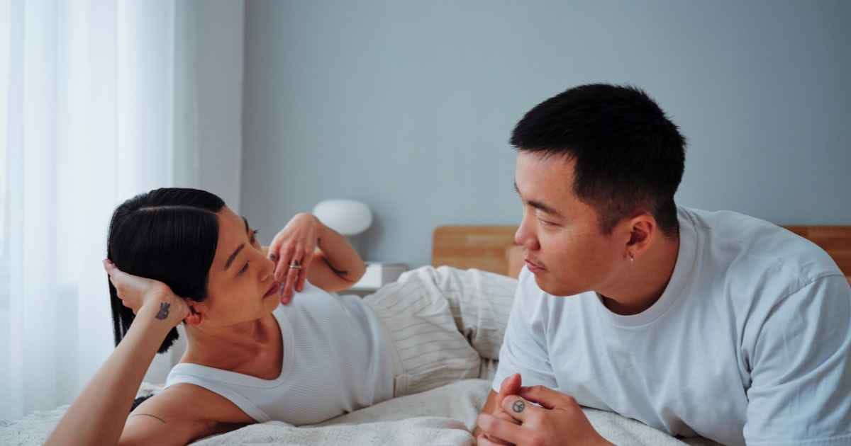 couple in bed talking