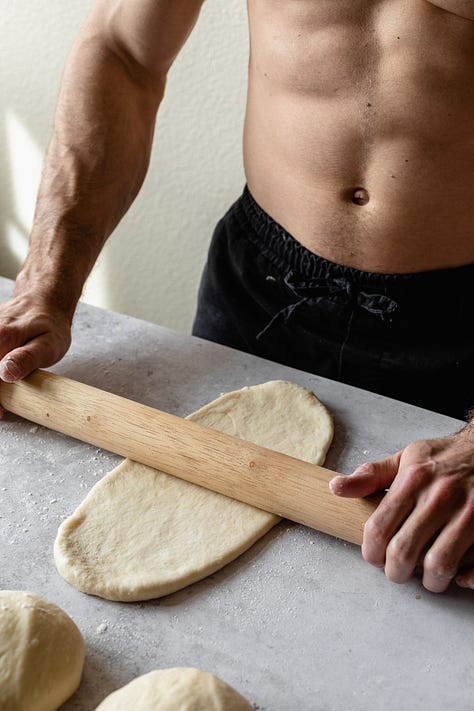 Shirtless baker in black pants making vegan milk bread loaves