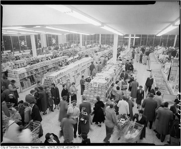 Two grocery stores, one with produce on stands out front and another with clean, well-lit aisles.