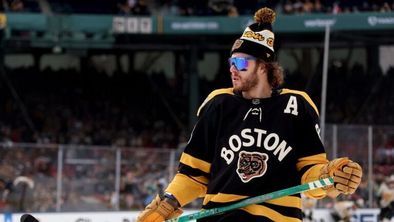 David Pastrnak #88 of the Boston Bruins warms up prior to a game against the Pittsburgh Penguins in the 2023 Discover NHL Winter Classic at Fenway Park on January 02, 2023 in Boston, Massachusetts.