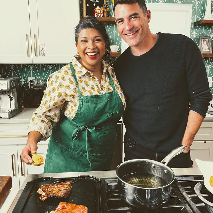 Aarti Sequeira's home kitchen, with Compassion international - dishes at the stove, film crew, food